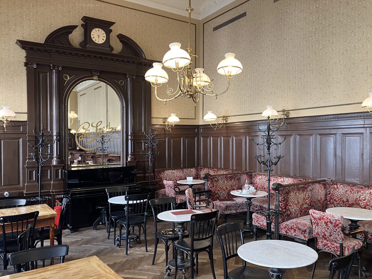 Marble tables, bentwood chairs, red banquettes and chandeliers inside Café Sperl, a traditional Viennese coffee house
