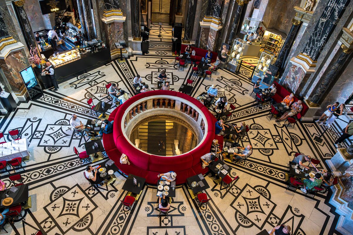Looking down from the gallery of the Kunsthistorisches Museum into the café under its central dome, with its patterned marble floor
