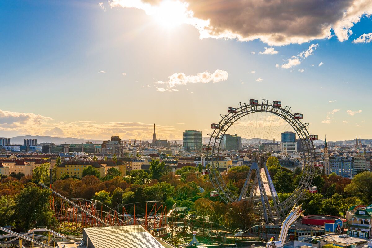 The Giant Ferris Wheel in the Prater with the Vienna skyline and St. Stephen's spire behind it