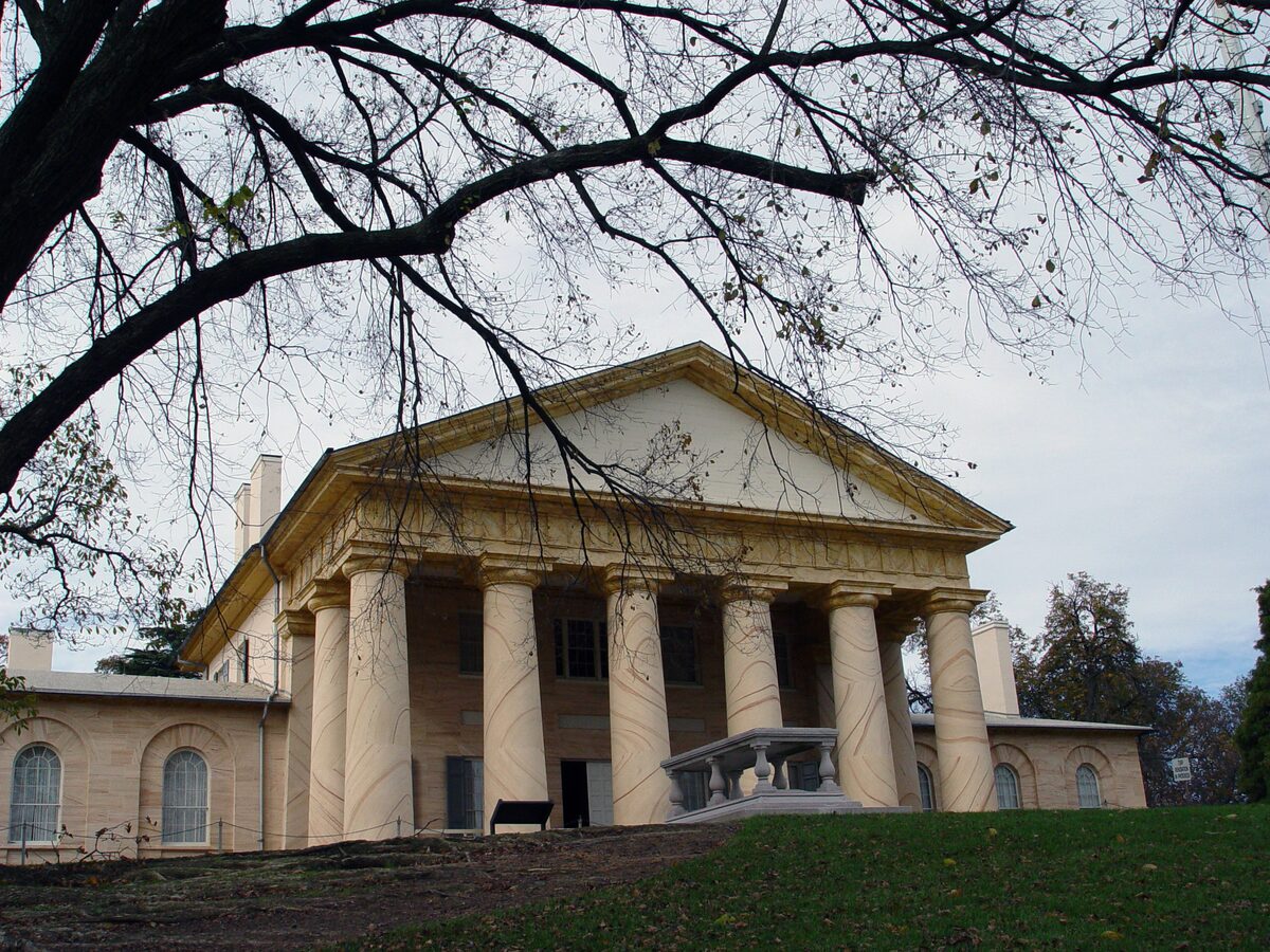 Columned front of Arlington House on the hill above the cemetery