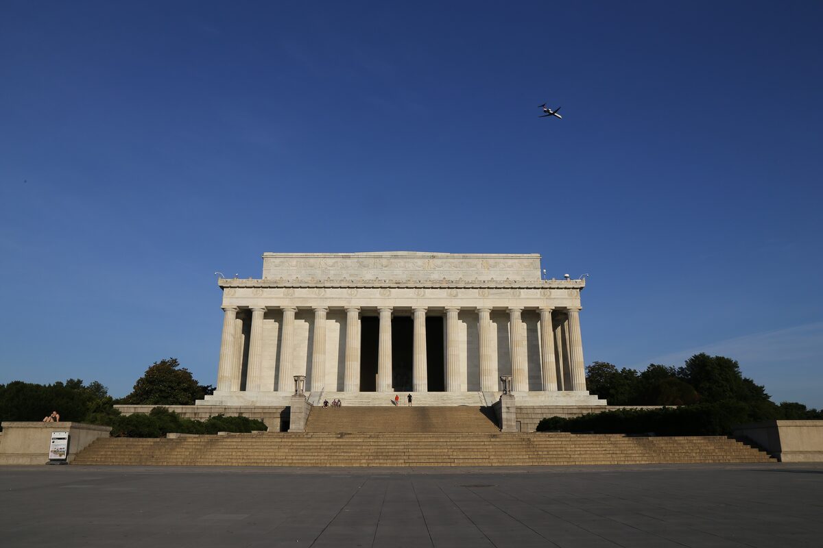 Lincoln Memorial columns and wide front steps under a blue sky