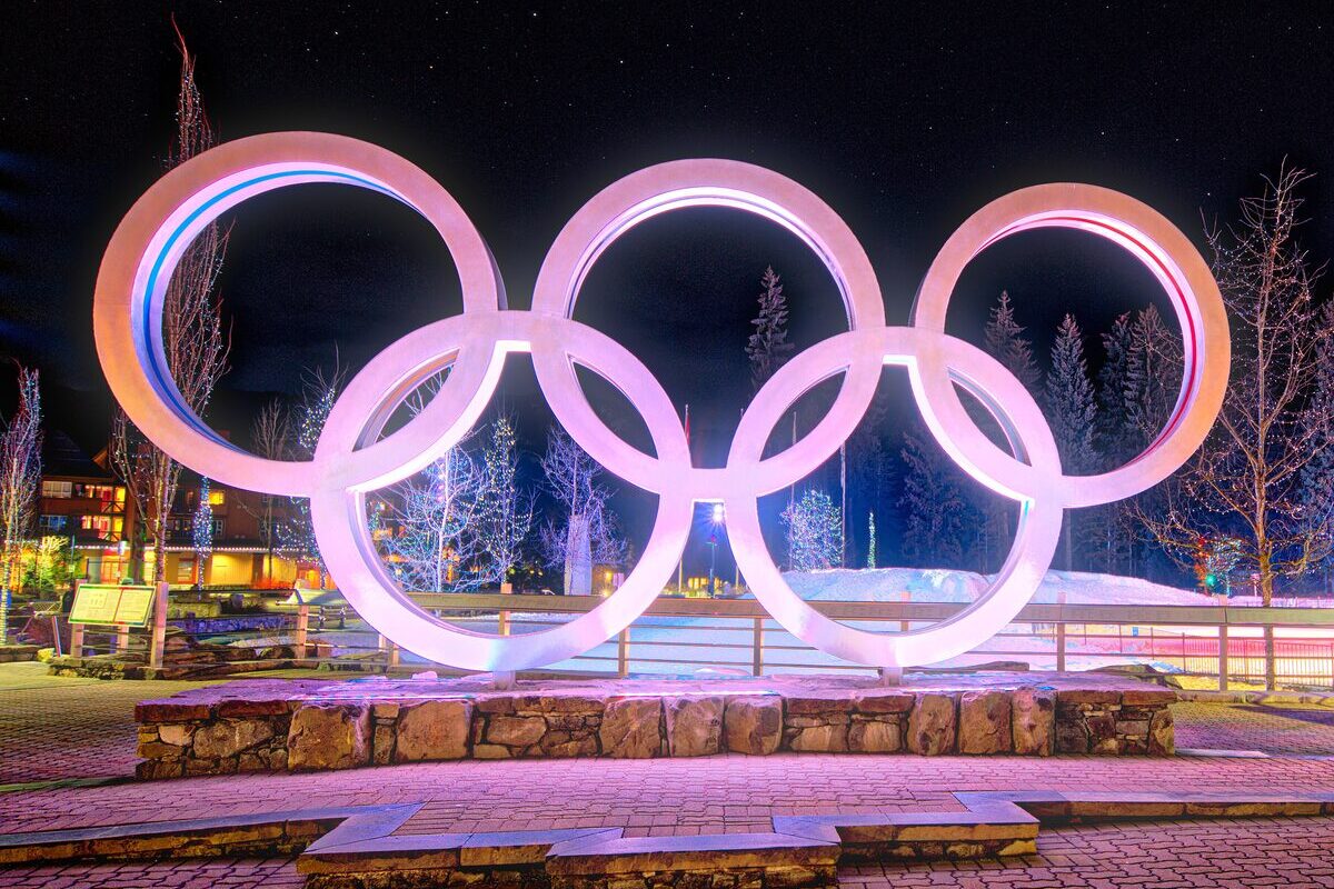 The Olympic rings monument in Whistler Olympic Plaza lit up at night