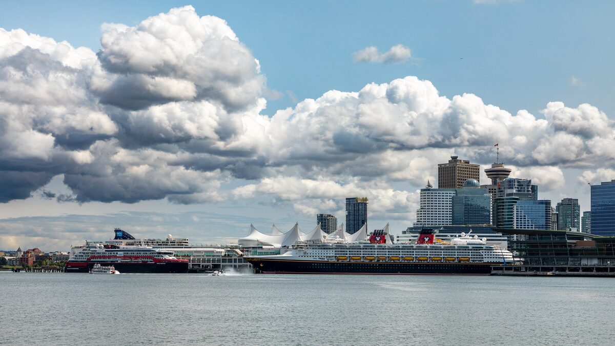 Vancouver's waterfront at Canada Place with the cruise ship terminal and downtown towers under big clouds