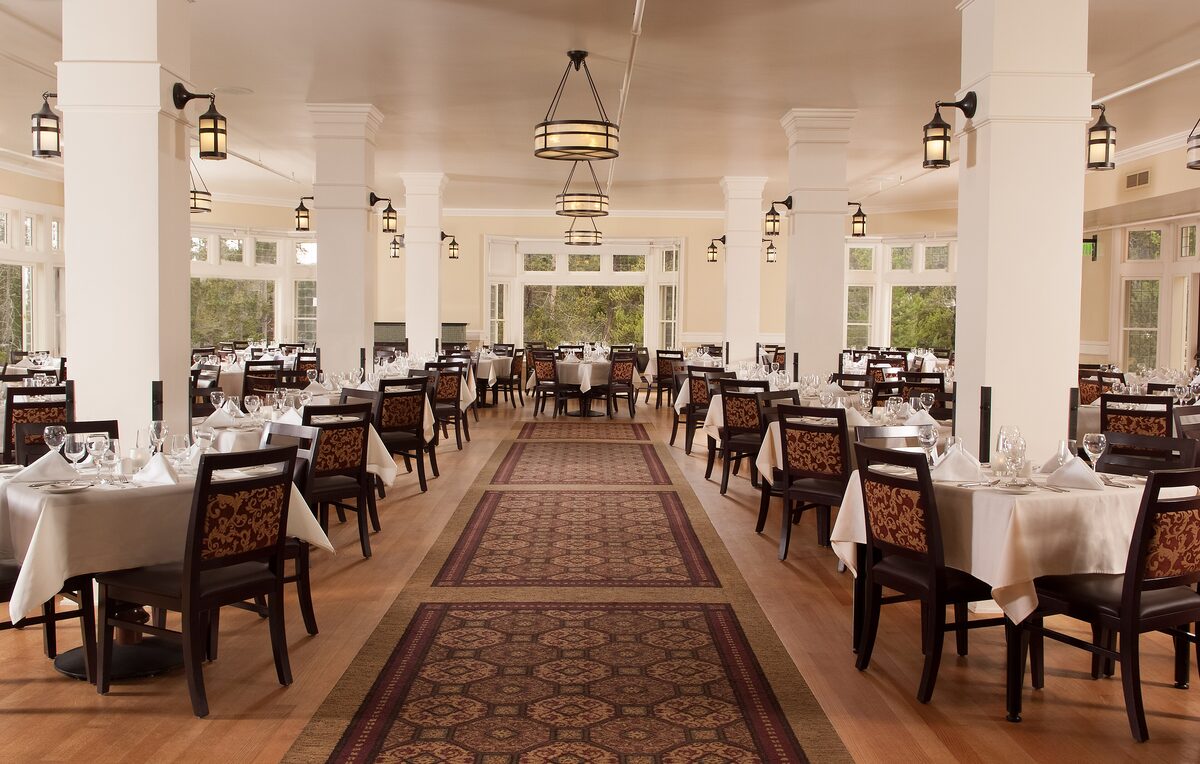 Set tables in the white Lake Hotel dining room