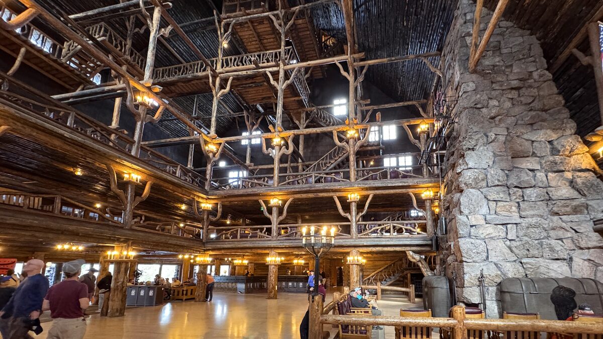 Log balconies and a stone chimney in the Inn lobby