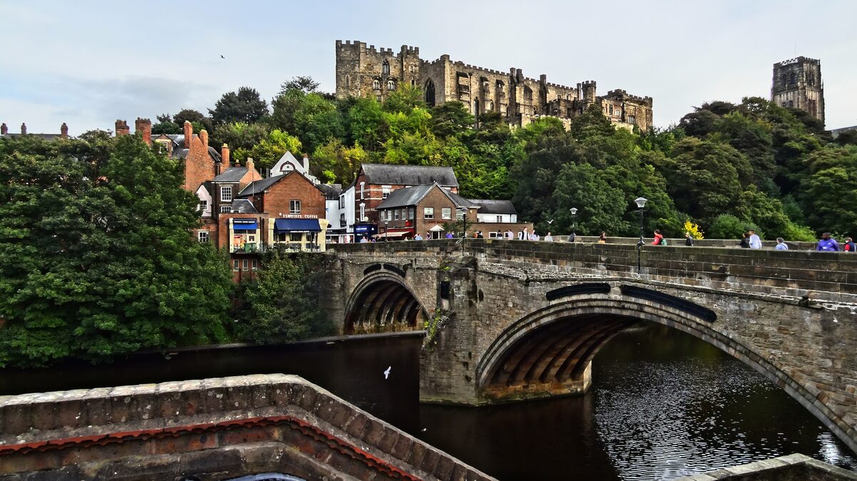 Durham Cathedral and the castle on a wooded hill above the river