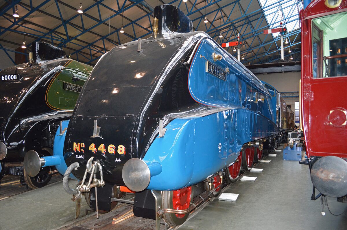 The blue streamlined steam locomotive Mallard on display in the Great Hall of the National Railway Museum