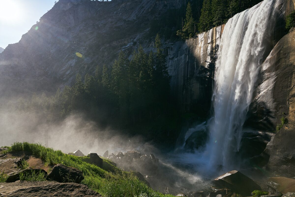 Vernal Fall pouring into mist beside the Mist Trail's granite cliffs