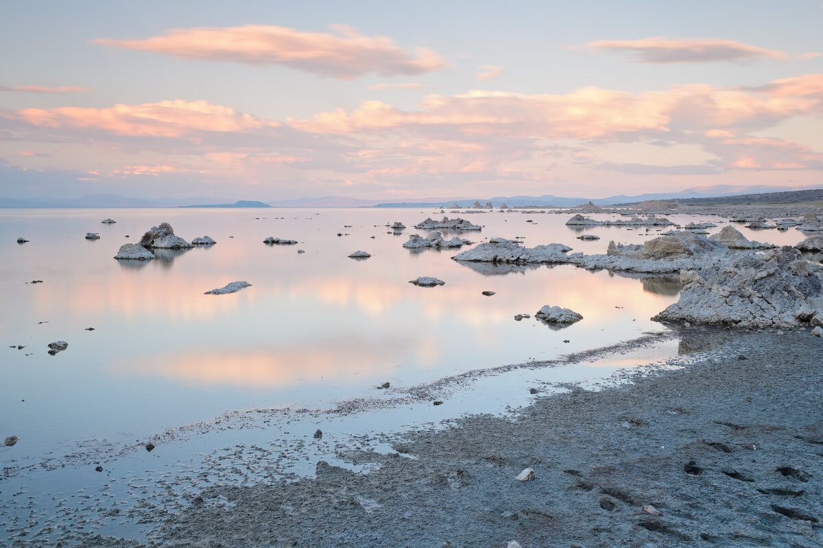 Tufa towers in Mono Lake at sunset under pink clouds
