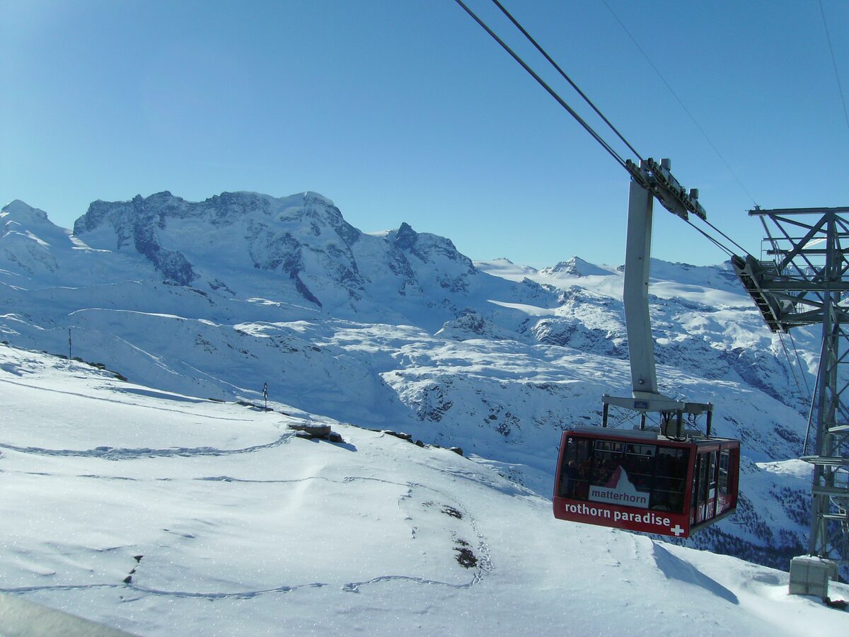 The Rothorn Paradise gondola over snowy slopes, with the Breithorn range behind