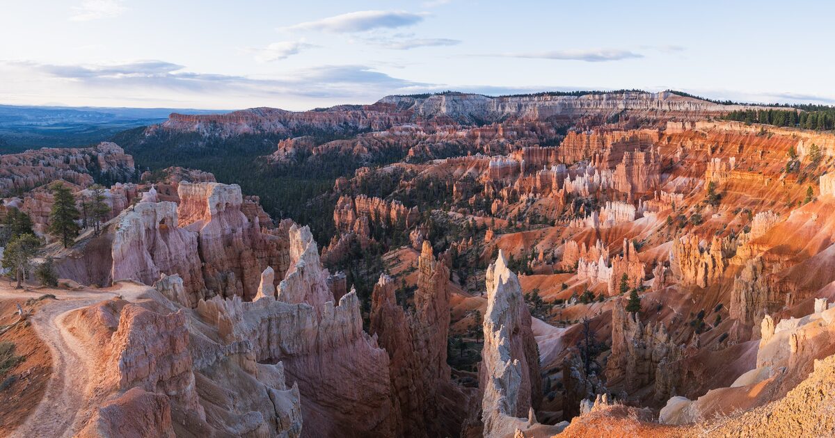 Bryce Canyon amphitheater hoodoos glowing in golden light at Sunrise Point