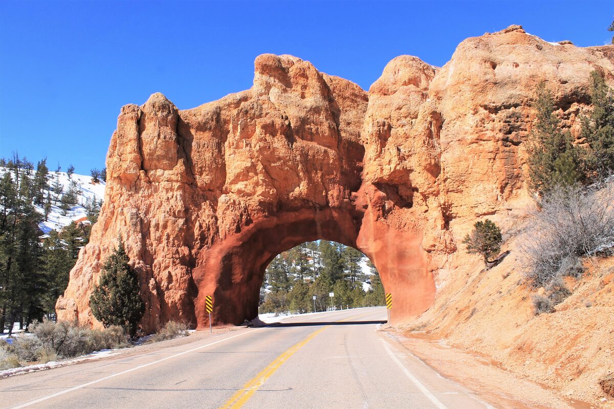 Red Canyon arch tunnel carrying Highway 12 through orange rock