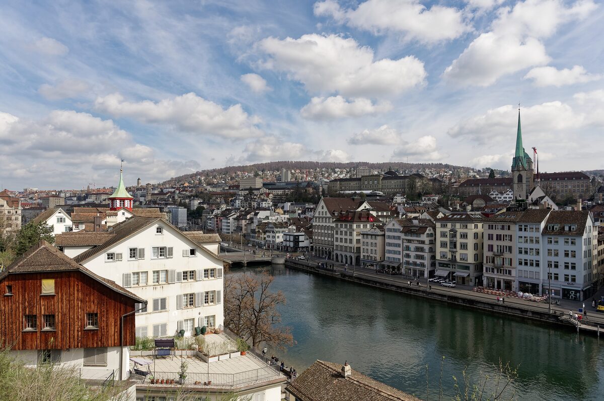 The Limmat and the old town roofs seen from the Lindenhof, with a green church spire on the right