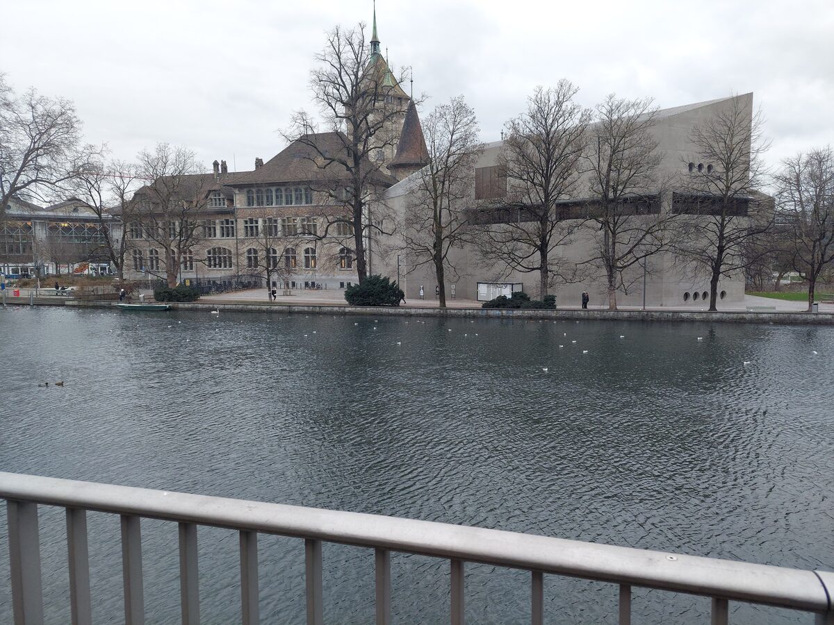 The Swiss National Museum's castle-style building across the Limmat, with the modern extension to the right